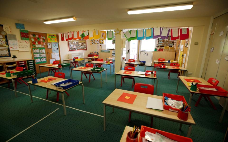 A classroom is seen with tables and chairs socially distanced at Heath Mount Prep School as they prepare to reopen following the outbreak of the coronavirus disease - Reuters