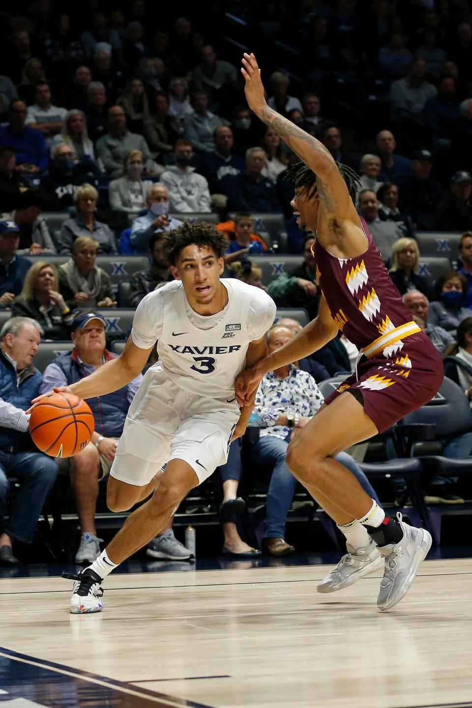 Xavier Musketeers guard Colby Jones (3) drives along the baseline in the first half of the NCAA basketball game between the Xavier Musketeers and the Central Michigan Chippewas at the Cintas Center in Cincinnati on Wednesday, Dec. 1, 2021. Xavier led 41-25 at halftime. 