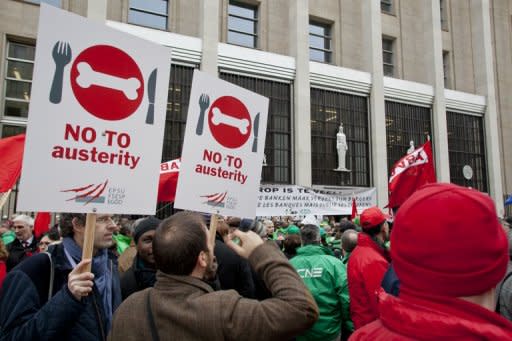 Protesters in Brussels in February. The OCED's chief economist says rising unemployment and social pain may spark political contagion and adverse market reaction