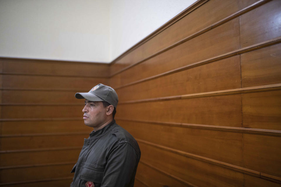 A member of security forces stands guard inside a court room before the start of a final trial session for suspects charged in connection with killing of two Scandinavian tourists in Morocco's Atlas Mountains, in Sale, near Rabat, Morocco, Thursday, July 18, 2019. The three main defendants in the brutal slaying of two female Scandinavian hikers have asked for forgiveness from Allah ahead of a verdict. (AP Photo/Mosa'ab Elshamy)