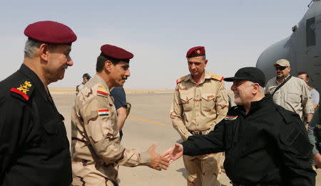 Iraqi Prime Minister Haider al-Abadi (R) is pictured in Mosul, Iraq, July 9, 2017. Iraqi Prime Minister Media Office/Handout via REUTERS