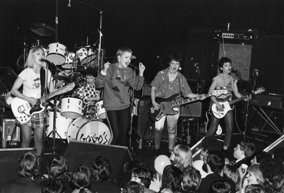 On stage at the Whiskey a Go Go in 1980. L-R: Charlotte Caffey, Gina Schock, Belinda Carlisle, Margot Olaverria, and Jane Wiedlin. (Credit: Donna Santisi/Redferns)