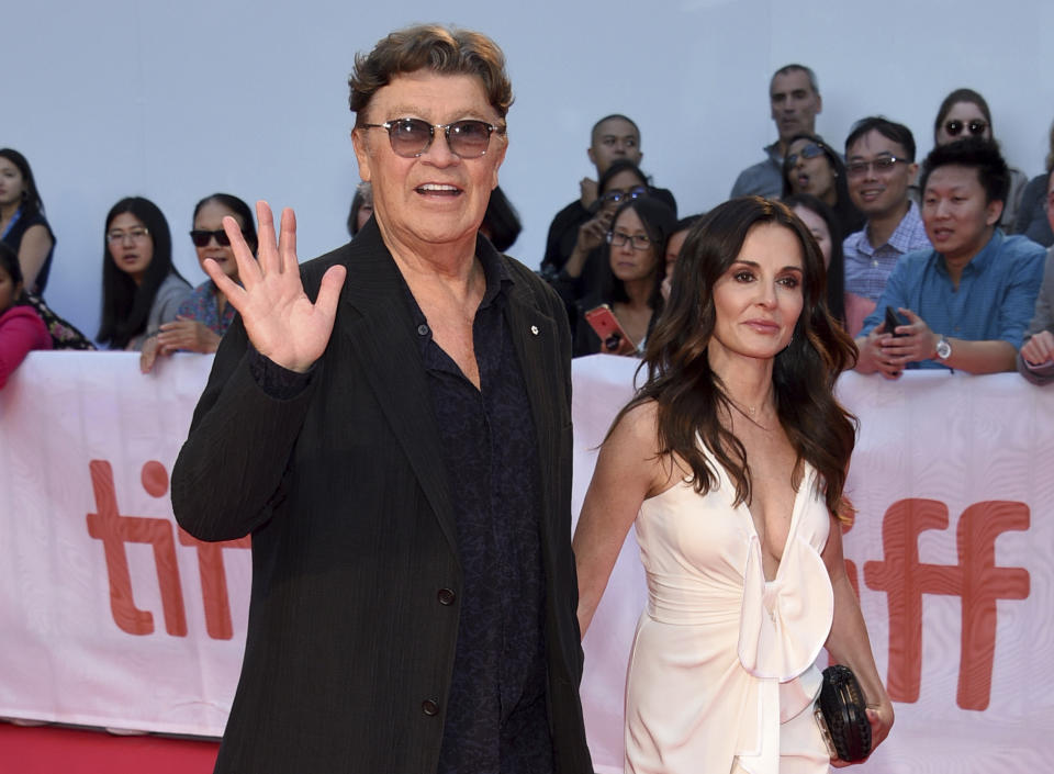 Robbie Robertson, left, and Janet Zuccarini attend the premiere for "Once Were Brothers: Robbie Robertson and The Band" on day one of the Toronto International Film Festival at the Roy Thomson Hall on Thursday, Sept. 5, 2019, in Toronto. (Photo by Evan Agostini/Invision/AP)
