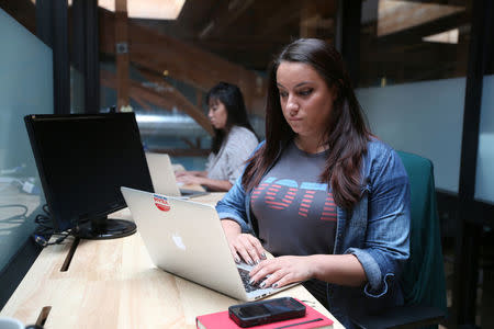 Rock the Vote Digital Director Sara Tabatabaie, 26, works on her computer in Los Angeles, California, U.S., November 4, 2016. REUTERS/Lucy Nicholson