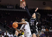 California Baptist guard Chloe Webb (2) looks towards the basket as Stephen F. Austin forward Mele Finau (35) defends during the first half of an NCAA college basketball game in the championship of the Western Athletic Conference women's tournament, Saturday, March 16, 2024, in Las Vegas. (AP Photo/David Becker)