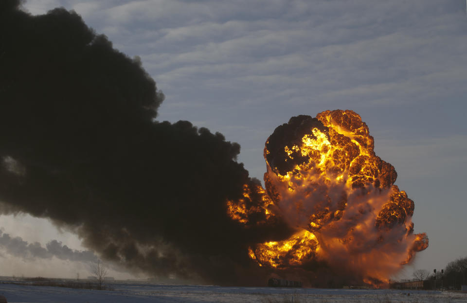 A fireball goes up at the site of an oil train derailment Monday, Dec 30, 2013, in Casselton, N.D. The train carrying crude oil derailed near Casselton Monday afternoon. Several explosions were reported as some cars on the mile-long train caught fire. (Bruce Crummy/AP)