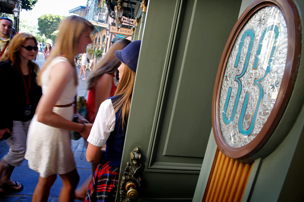 Visitors go into Club 33 on April 18, 2013, at Disneyland in Anaheim, California. (Photo: Don Bartletti/Los Angeles Times via Getty Images) 