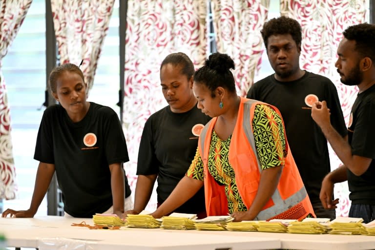 Electoral officers count votes from the general election in Solomon Islands, where pro-China Prime Minister Manasseh is reported to have retained his seat (Saeed KHAN)