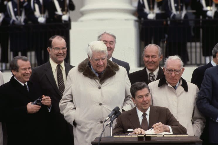 President Reagan signs the Social Security reform bill in 1983.