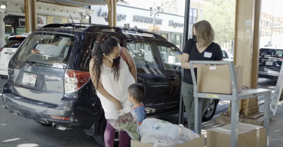 Nohemi Galindo, 32, picks up her monthly distribution of food from the Nourishing Hope food pantry in Chicago.