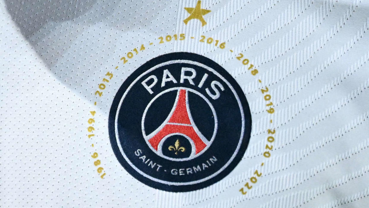 This photograph taken during the French L1 football match between Strasbourg RC and Paris Saint-Germain (PSG) at La Meinau stadium in Strasbourg, on April 29, 2022 shows PSG's logo with the years they won the L1 championship since 1986. (Photo by SEBASTIEN BOZON / AFP)