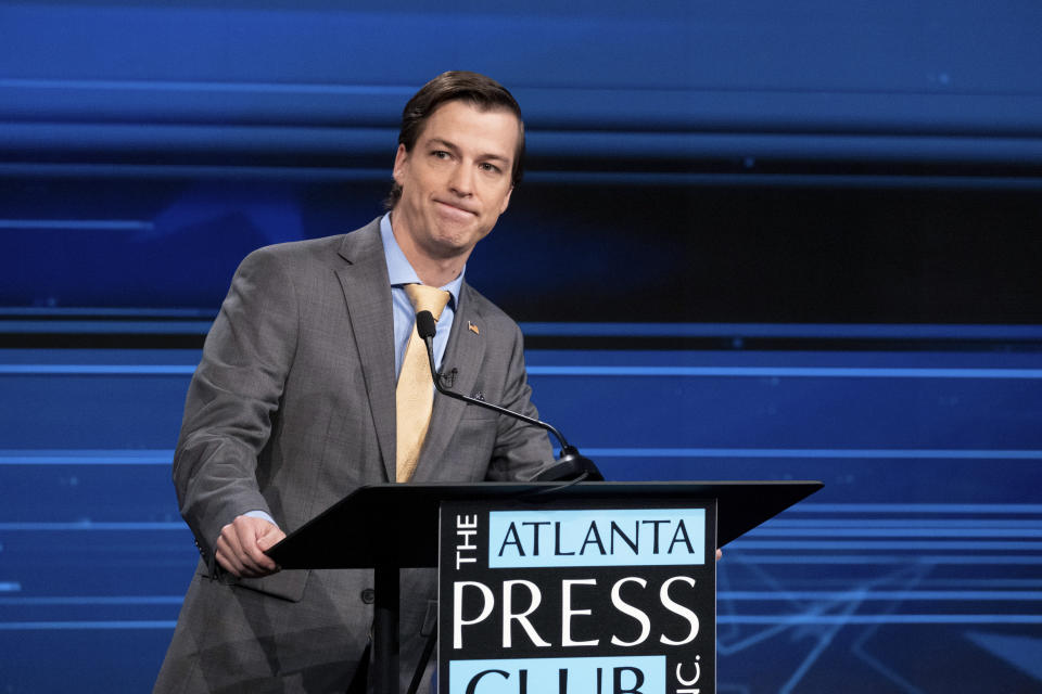 Libertarian challenger Chase Oliver pauses during a U.S. Senate debate with Sen. Raphael Warnock, D-Ga., during the Atlanta Press Club Loudermilk-Young Debate Series in Atlanta on Sunday, Oct. 16, 2022. Republican challenger Herschel Walker was invited but did not attend. (AP Photo/Ben Gray)