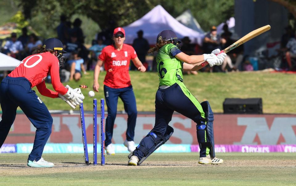 Ireland's Leah Paul (R) is bowled by England's Sarah Glenn (not seen) during the Group B T20 women's World Cup cricket match between Ireland and England at Boland Park in Paarl on February 13, 2023 - RODGER BOSCH/AFP via Getty Images