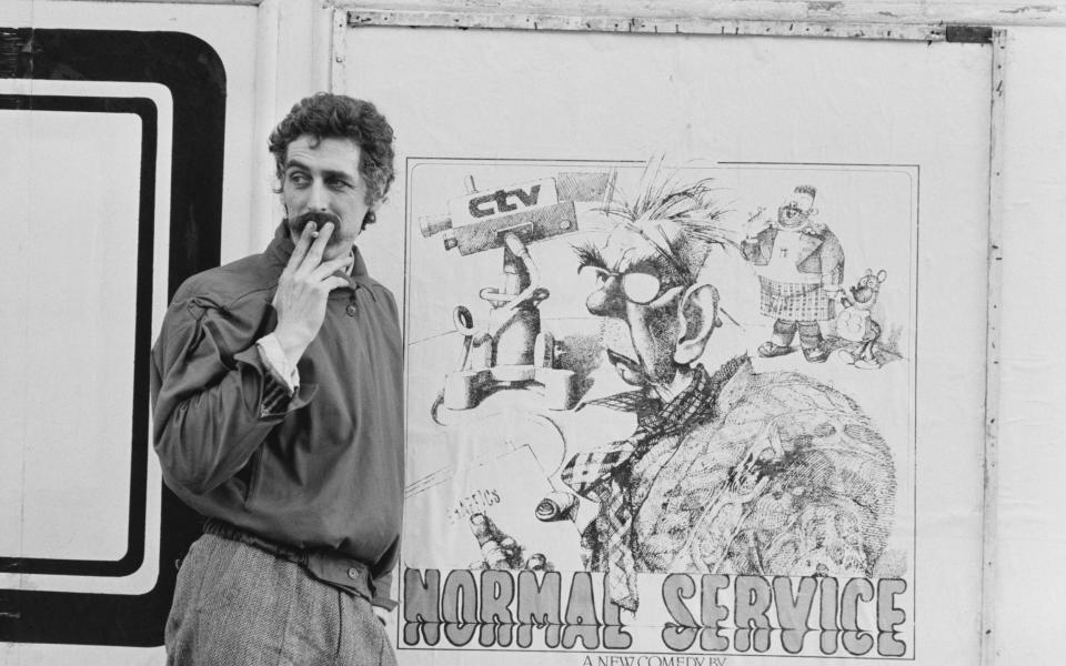 Byrne with a poster promoting his comedy Normal Service, 1979