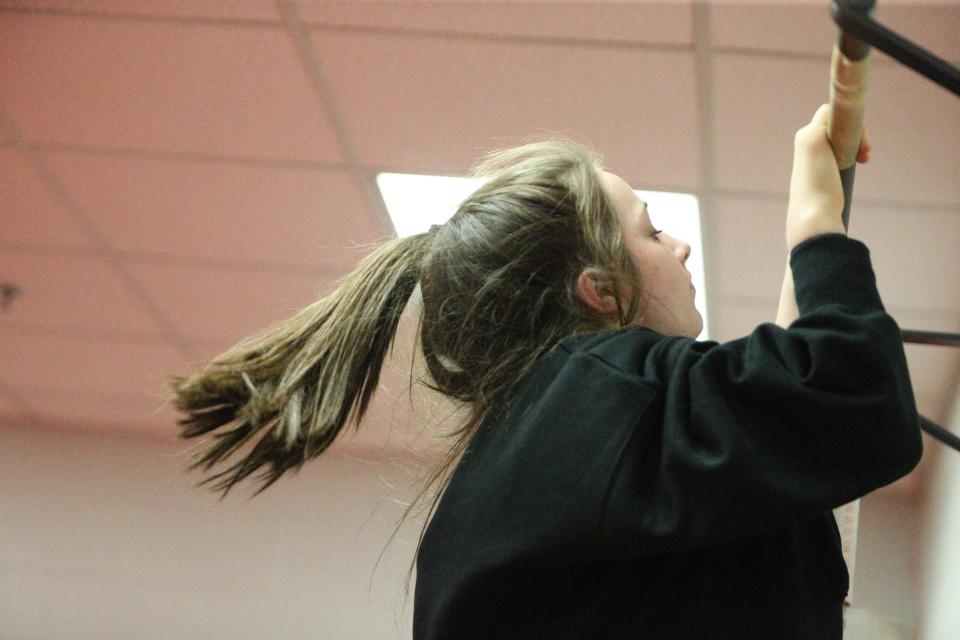 West Lafayette sophomore Isabel Kaplan performs a chin up for after practice conditioning on Wednesday, Jan. 3, 2024.