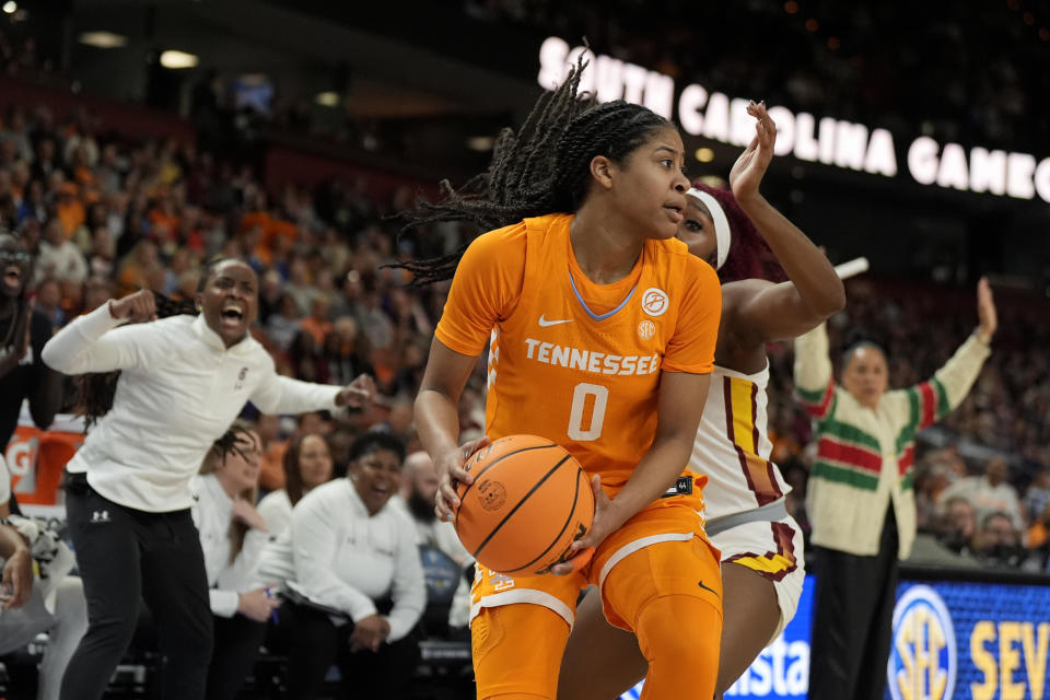 Tennessee guard Jewel Spear is guarded by South Carolina guard Raven Johnson during the first half of an NCAA college basketball game at the Southeastern Conference women's tournament Saturday, March 9, 2024, in Greenville, S.C. (AP Photo/Chris Carlson)