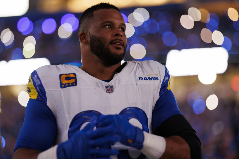 DETROIT, MICHIGAN - JANUARY 14: Aaron Donald #99 of the Los Angeles Rams looks on from the sideline prior to an NFC Wild Card Playoff football game against the Detroit Lions at Ford Field on January 14, 2024 in Detroit, Michigan. (Photo by Ryan Kang/Getty Images)