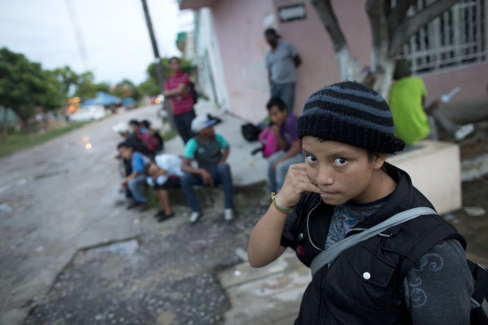 CLICK IMAGE for slideshow: In this June 19, 2014 photo, a 14-year-old Guatemalan girl traveling alone waits for a northbound freight train along with other Central American migrants, in Arriaga, Chiapas state, Mexico. The United States has seen a dramatic increase in the number of Central American migrants crossing into its territory, particularly children traveling without any adult guardian. More than 52,000 unaccompanied children have been apprehended since October. (AP Photo/Rebecca Blackwell)