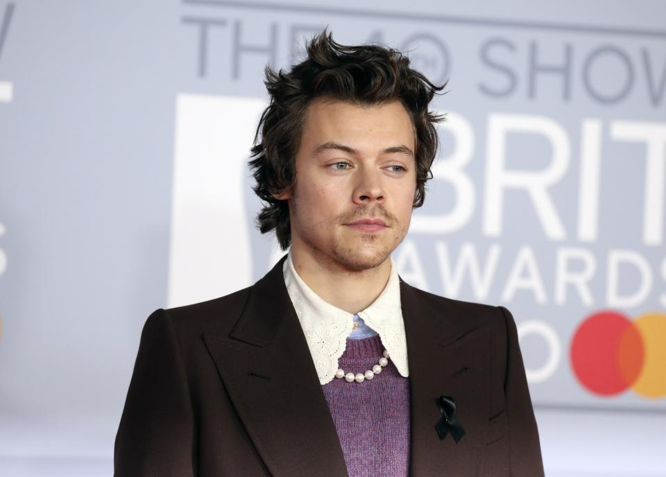 Harry Styles poses for photographers upon arrival at Brit Awards 2020 in London, Tuesday, Feb. 18, 2020.(Photo by Vianney Le Caer/Invision/AP)