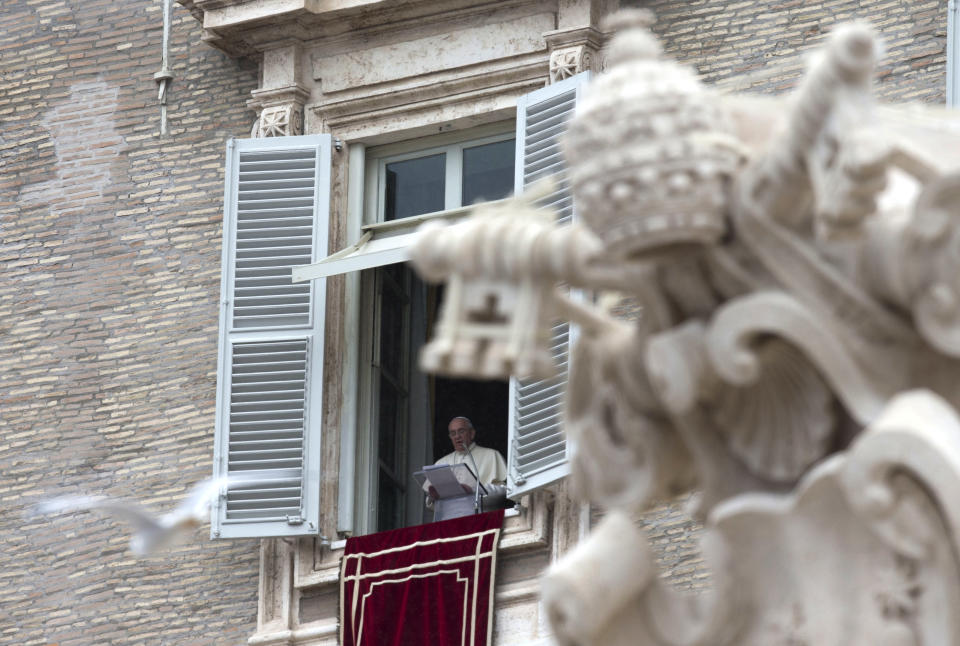 Pope Francis delivers his message during the Angelus prayer from his studio window overlooking St. Peter's Square at the Vatican, Sunday, March 2, 2014. Pope Francis is urging all segments of Ukrainian society to work to overcome incomprehension and build a future together. Francis spoke of what he called Ukraine's "delicate" situation after he greeted thousands of people in St. Peter's Square for his traditional Sunday midday appearance. (AP Photo/Alessandra Tarantino)