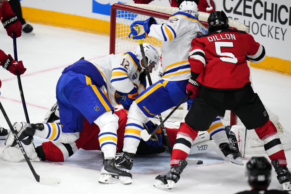 Buffalo Sabres' Tage Thompson, 2nd right, scores his sides first goal during the NHL hockey game between Buffalo Sabres and New Jersey Devils, in Prague, Czech Republic, Saturday, Oct. 5, 2024. (AP Photo/Petr David Josek)