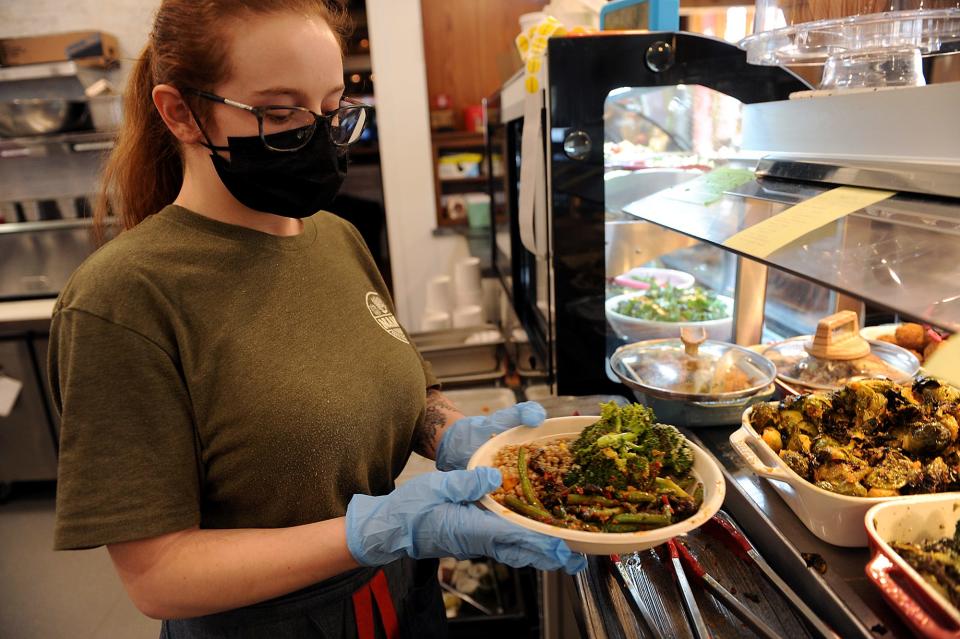 At Nan's Rustic Kitchen & Market in Stow, Nic Jodice makes a bowl of brine chicken, organic farro, pesto-covered broccoli and spicy beans, March 8, 2022. Nan's is opening a second location in a former Wendy's on Route 9 in Southborough.