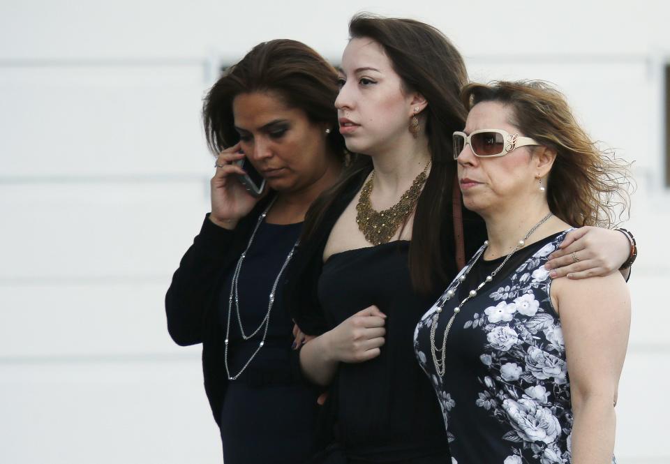 People arrive for the funeral of Jordan Segura in Calgary