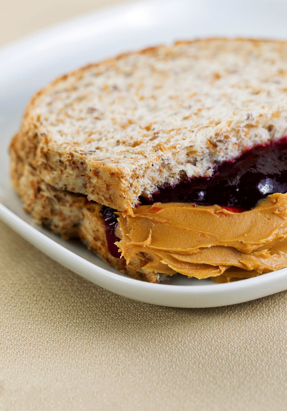 The ideal midday meal includes protein and fiber, and isn't too high in refined carbs. On days when that just didn't happen, try a late-afternoon do-over, albeit one that won't ruin you for dinner in three hours. Half of a classic <strong>peanut butter and jelly sandwich</strong> can do the trick, since it contains <a href="http://www.oprah.com/food/Healthy-Snacks-Nutritionists-Eat/2" target="_blank">fiber and protein</a>. Bonus points for using whole grain bread, low-sugar jelly and PB made from just two ingredients: peanuts and salt.