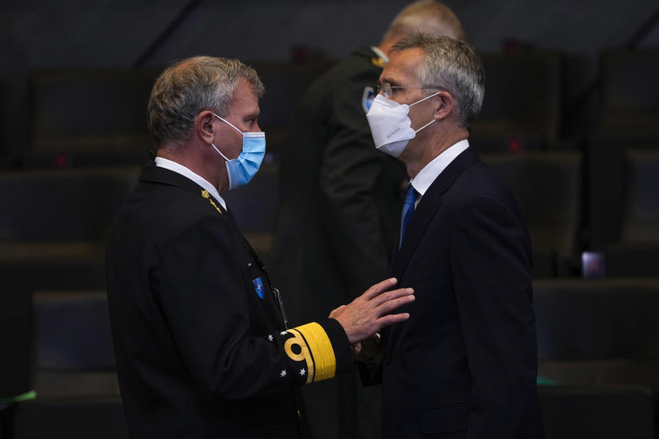 NATO Secretary General Jens Stoltenberg, right, talks to Chair of the NATO Military Committee Admiral Rob Bauer during a NATO Foreign Ministers video meeting following developments in Afghanistan at the NATO headquarters in Brussels, Friday, Aug. 20, 2021. (AP Photo/Francisco Seco, Pool)