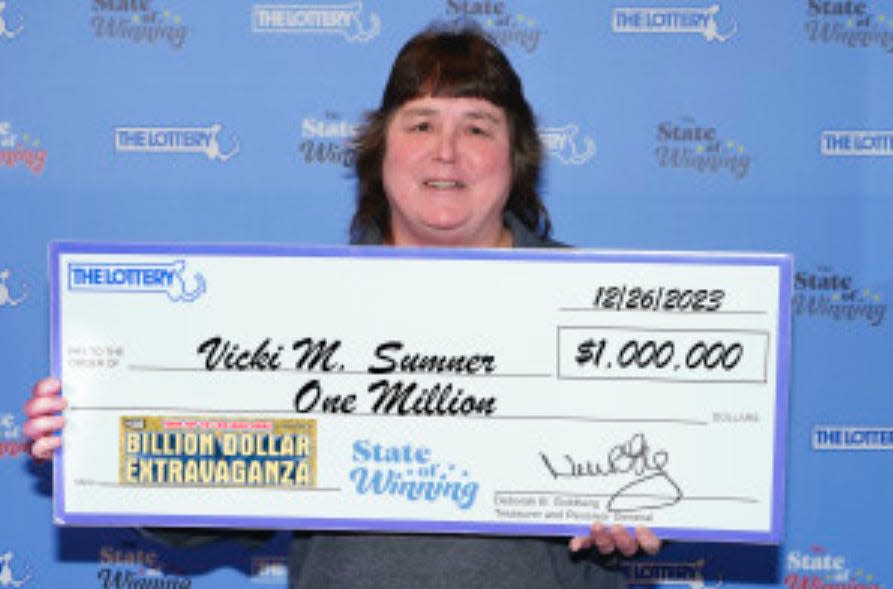 Vicki Sumner of Bernardston with her $1 million check.