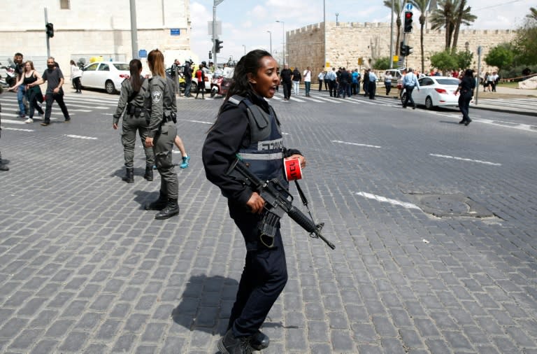 Israeli security forces gather at the site of a stabbing in Jerusalem on April 14, 2017