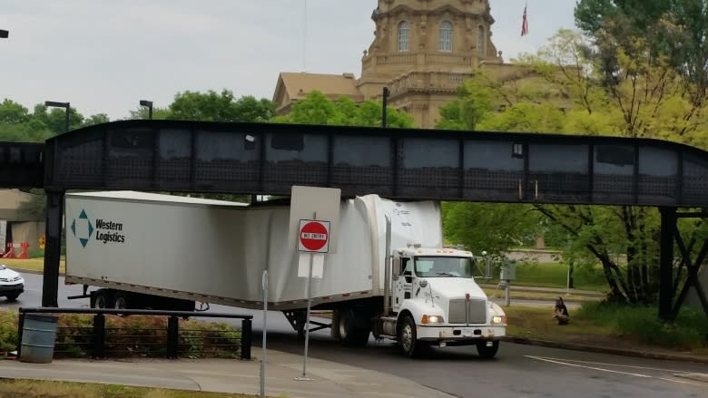 Semi-truck unstuck at entrance to High Level bridge