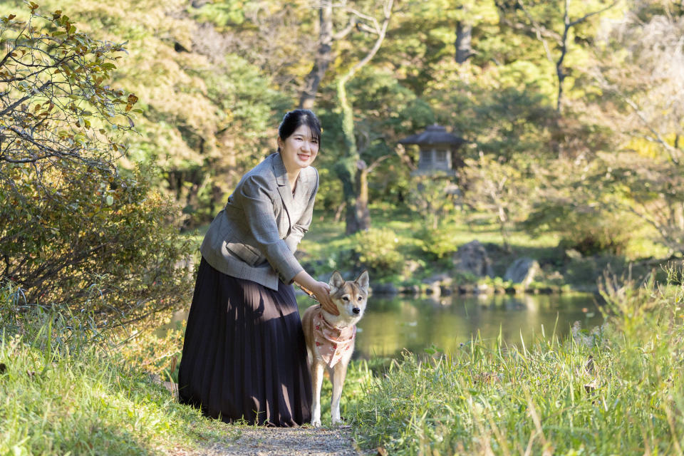 In this photo provided by the Imperial Household Agency of Japan, Princess Aiko, daughter of Emperor Naruhito and Empress Masako, strolls the garden of the Imperial Residence at the Imperial Palace in Tokyo on Nov. 14, 2021, ahead of her 20th birthday on Dec. 1, 2021. (The Imperial Household Agency of Japan via AP)