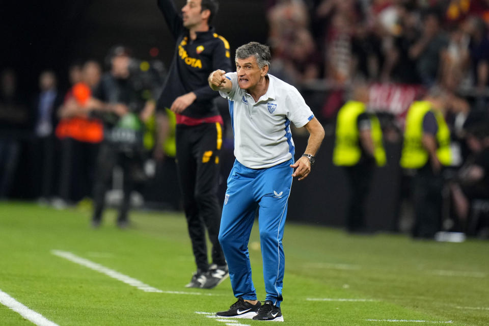 Sevilla's head coach Jose Luis Mendilibar gestures during the Europa League final soccer match between Sevilla and Roma, at the Puskas Arena in Budapest, Hungary, Wednesday, May 31, 2023. (AP Photo/Petr David Josek)
