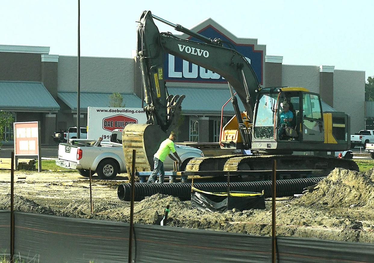 Construction continues on many of the new businesses growing up around the Leland Town Center on Wednesday June 28, 2023. A new Lowes, 7-Eleven and car wash are just a few of the new sites under construction.  [KEN BLEVINS/STARNEWS]