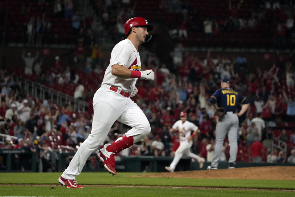 St. Louis Cardinals' Andrew Knizner, left, rounds the bases after hitting a grand slam off Milwaukee Brewers pitcher Mike Brosseau (10) during the eighth inning of a baseball game Monday, May 15, 2023, in St. Louis. (AP Photo/Jeff Roberson)