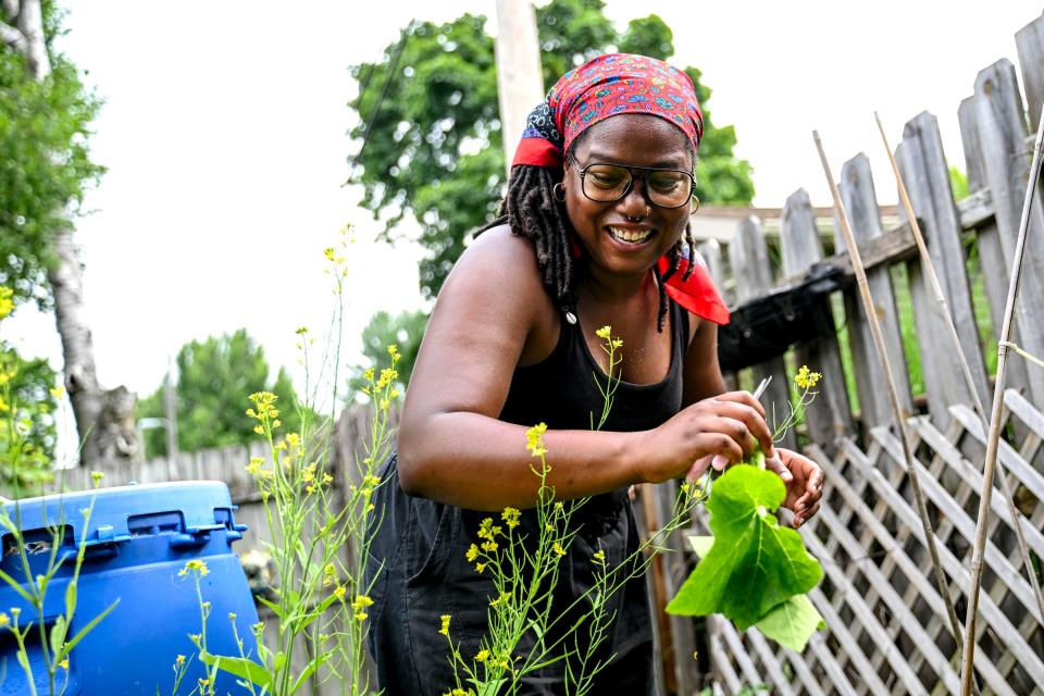 Hillary Coleman, owner of 1991greenery, works in her garden on Wednesday, June 19, 2024, in Lansing.