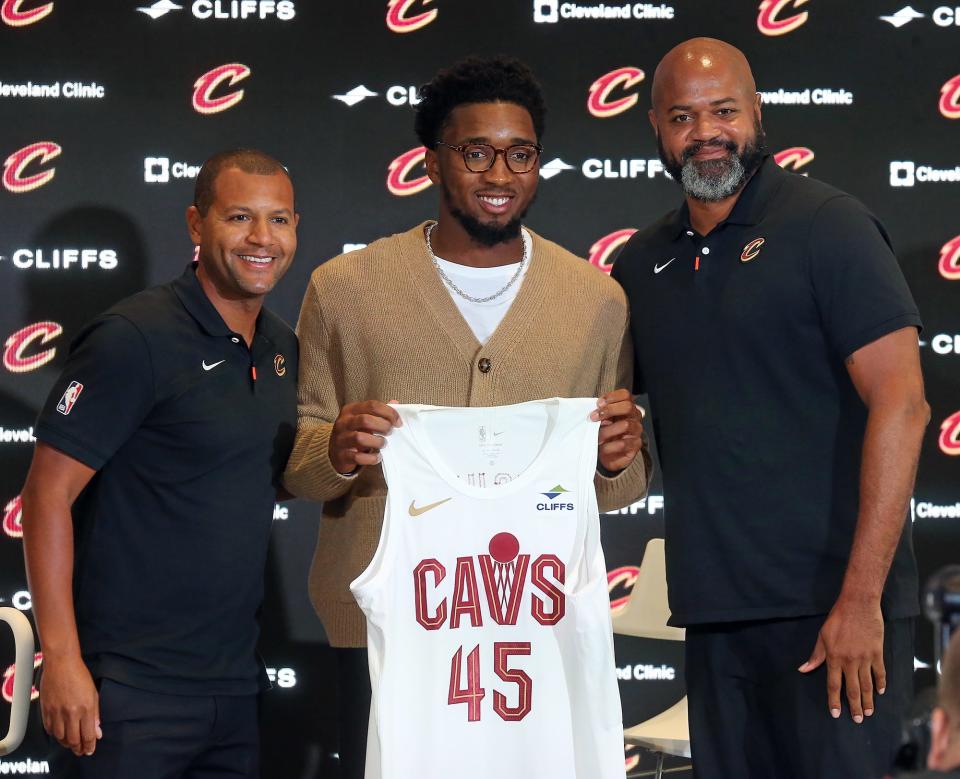 Cleveland Cavaliers guard Donovan Mitchell, center, poses with his new coach J.B. Bickerstaff, right, and President of Basketball Operations Kobe Altman during his introductory press conference at Rocket Mortgage FieldHouse, Wednesday, Sept. 14, 2022, in Cleveland, Ohio.