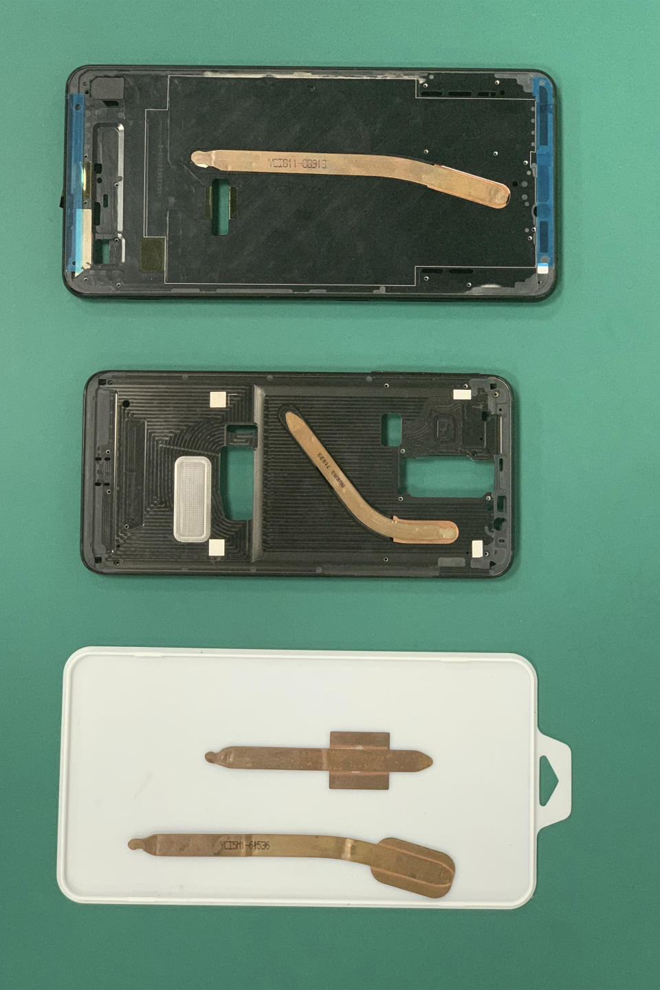 In this Aug. 21, 2019, photo, copper heat pipes are portrayed on mobile phone cases displayed at the Huawei Thermal design lab in Dongguan in Southern China's Guangdong province.. Facing a ban on access to U.S. technology, Chinese telecom equipment maker Huawei is showing it increasingly can do without American components and compete with Western industry leaders in pioneering research. (AP Photo/Ng Han Guan)