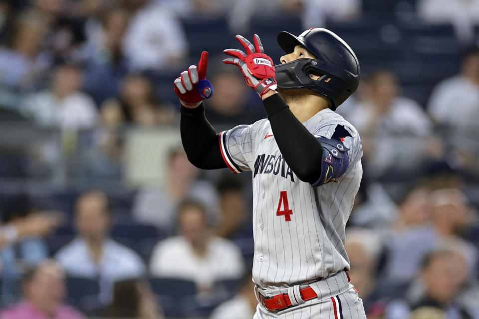 Minnesota Twins' Carlos Correa reacts after hitting a home run against the New York Yankees during the first inning of a baseball game Thursday, April 13, 2023, in New York. (AP Photo/Adam Hunger)