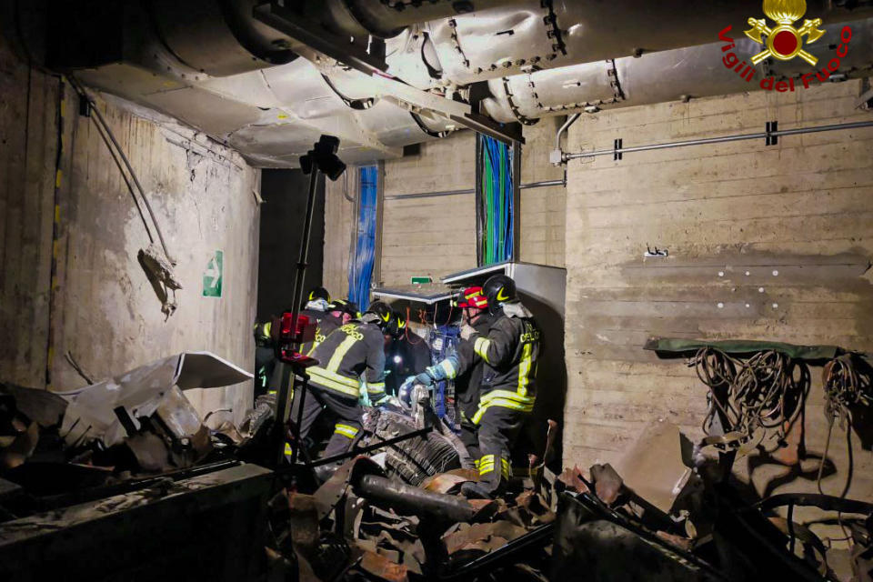 This picture made available by the Italian Fire Brigades on Tuesday, April 9, 2024, shows the rescue operations inside the Enel Green Power hydroelectric plant of the Suviana Dam, some 70 kilometers southwest of Bologna, northern Italy on Tuesday, April 9, 2024. Search and rescue operations were still underway on Wednesday, April 10, 2024, at a decades-old hydroelectric plant after a devastating blast a day before killed at least three workers, injured five, and left four missing. (Italian Fire Brigades via AP, HO)