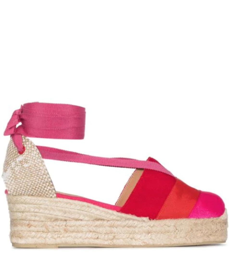 Castañer ribbon tie 50mm wedge espadrilles. Image via Farfetch.