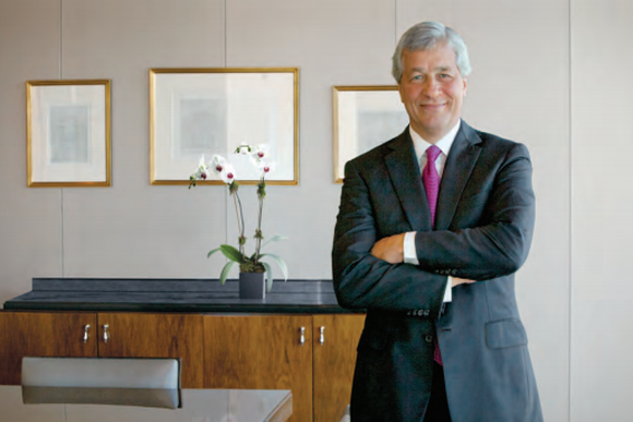 JPMorgan Chase chairman and CEO Jamie Dimon, standing with his arms crossed.