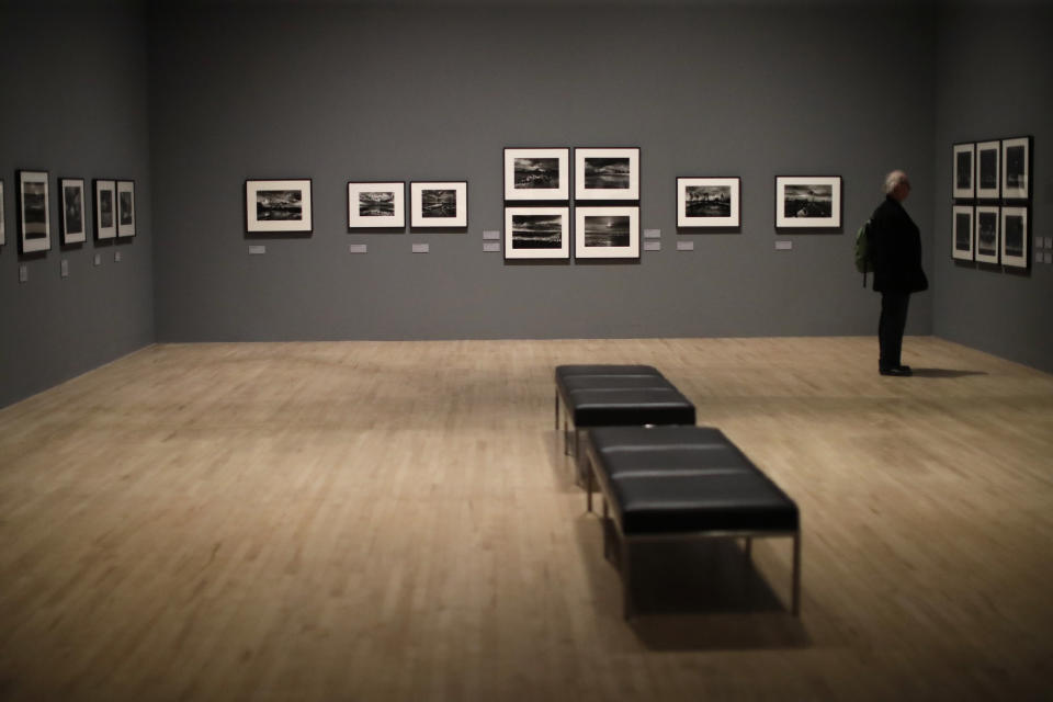 Landscape photographs by veteran British conflict photographer Don McCullin are displayed at the launch of his retrospective exhibition at the Tate Britain gallery in London, Monday, Feb. 4, 2019. The exhibition includes over 250 of his black and white photographs, including conflict images from the Vietnam war, Northern Ireland, Cyprus, Lebanon and Biafra, alongside landscape and still life images. (AP Photo/Matt Dunham)