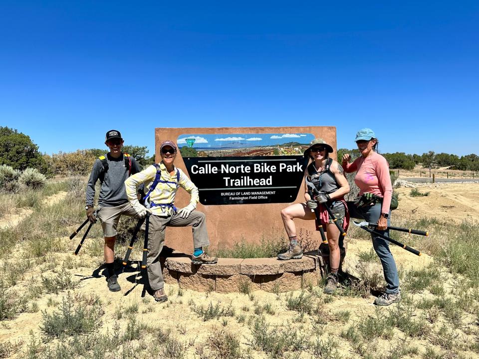 Volunteers pose for a photo after taking part in a cleanup day at the Calle Norte Bike Park Trailhead, one of several annual cleanup events on public lands held throughout the city.