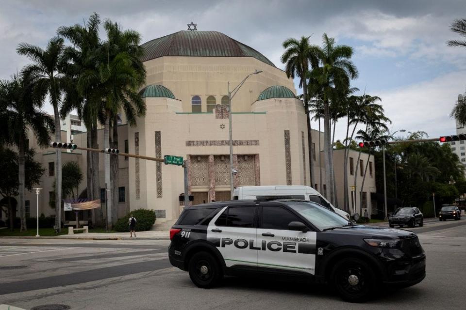A Miami Beach police patrol drives past Temple Emanu-El synagogue in Miami Beach, Florida, on October 9, 2023.