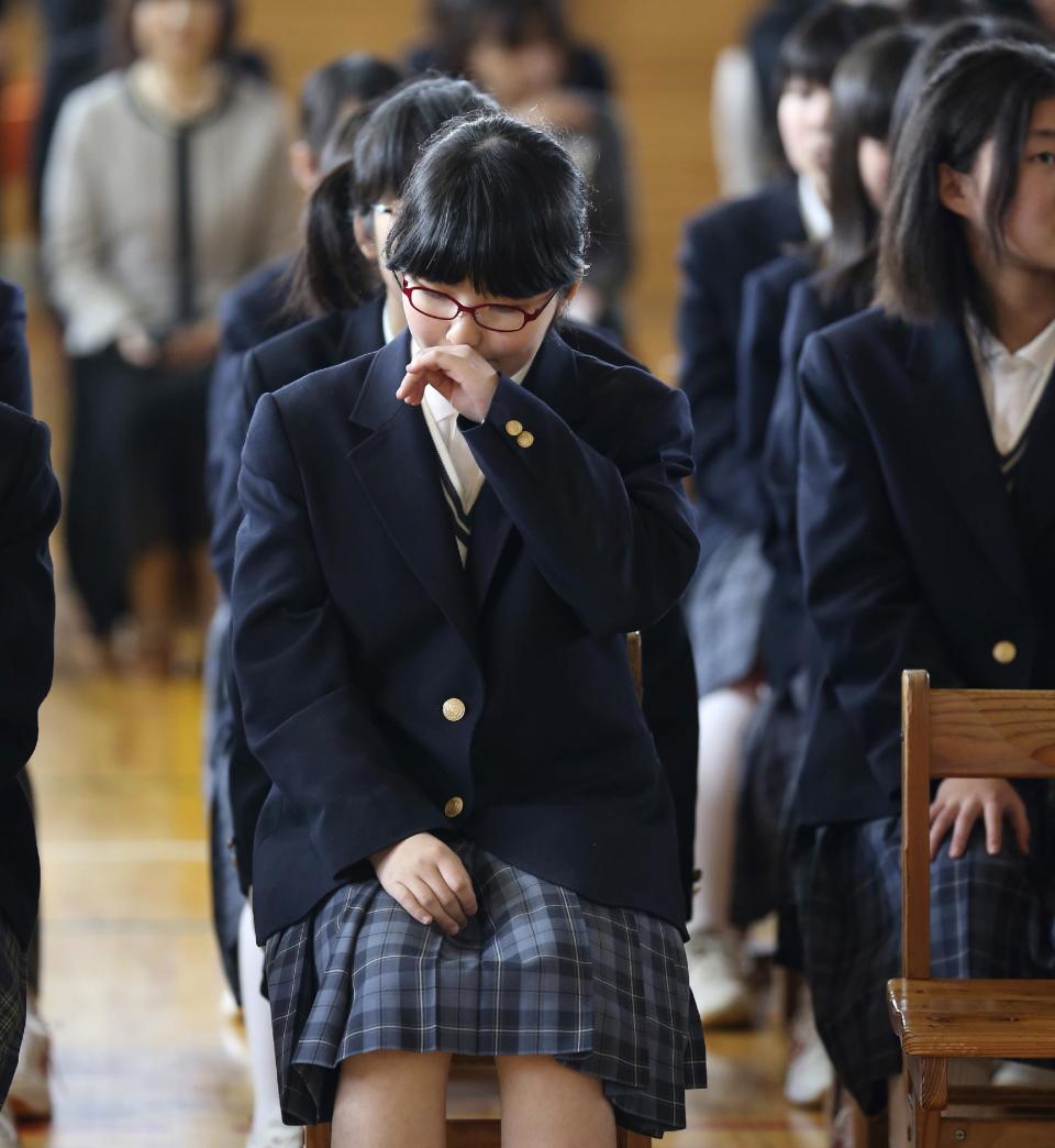 In this Saturday, April 5, 2014 photo, Kokoro Kamiyama, 13, attends an opening ceremony of her Aida junior high school as she starts her new life in Matsumoto, central Japan, after moving from Fukushima. Kamiyama is the first child to sign on to the Matsumoto project which Chernobyl-doctor-turned-mayor Akira Sugenoya of Matsumoto, offered his Japanese town to get children out of Fukushima. Kamiyama was prone to skipping school when she was in Fukushima, which her mother believes was a sign of stress from worrying about radiation. She is happy she can run around outdoors in the city without wearing a mask. “The air feels so clean here,” Kamiyama said. (AP Photo/Koji Sasahara)