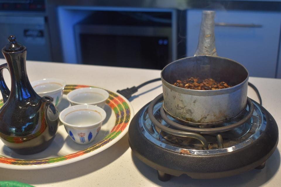 A pot of fresh-roasted Ethiopian coffee beans rest on a counter in Fort Collins' new Konjo Ethiopian Coffeehouse, which opened in May.