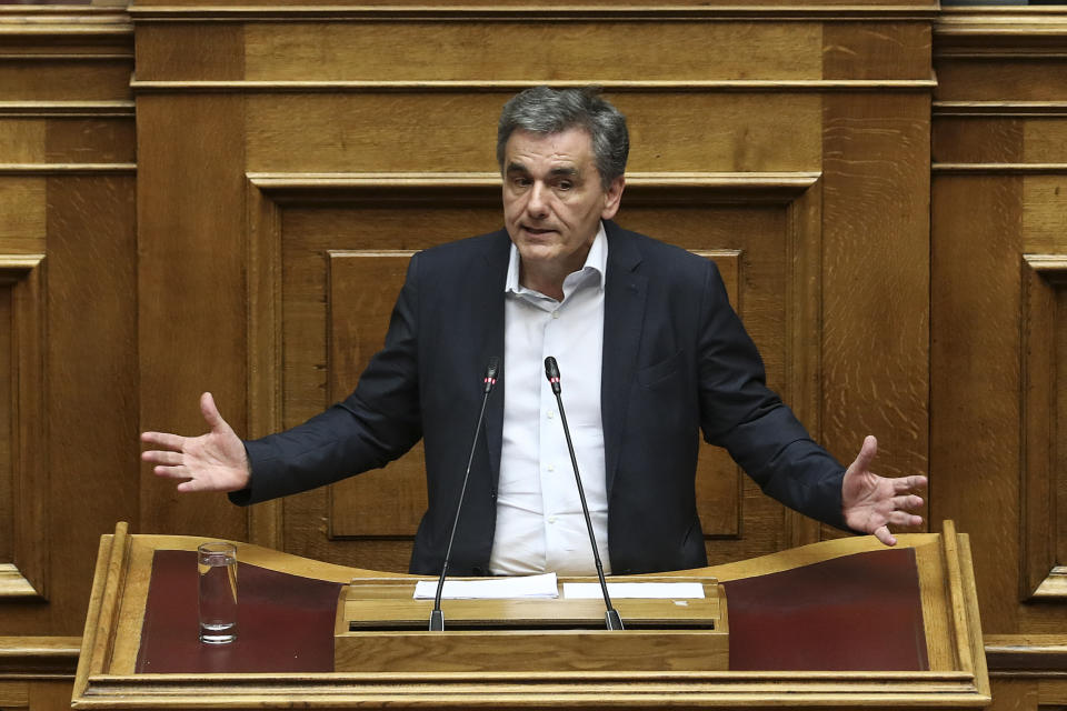 FILE - Greece's then Finance Minister Euclid Tsakalotos, delivers a speech during a parliamentary session in Athens, on Friday, May 10, 2019. Greece’s main opposition party suffered a split Sunday when a left-wing faction announced it was breaking away and accused the party’s recently-elected leader of abandoning its ideology for a sort of “right-wing populism”. Umbrella, a faction led by Euclid Tsakalotos, a former Finance Minister during Syriza’s government of 2015-19, announced its departure with a blistering statement. (AP Photo/Yorgos Karahalis, File)