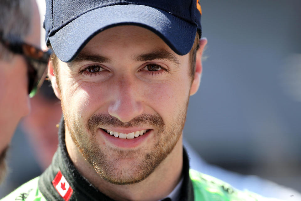 INDIANAPOLIS, IN - MAY 18: James Hinchcliffe prepares to drive the #27 Team GoDaddy.com car during Indianapolis 500 practice at Indianapolis Motor Speedway on May 18, 2012 in Indianapolis, Indiana. (Photo by Andy Lyons/Getty Images)